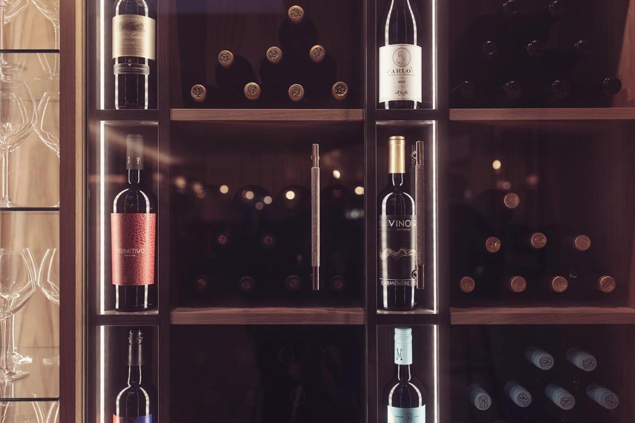 Longlands Inn & Cottages Carnforth Bagian luar foto Wine bottles in a wine rack