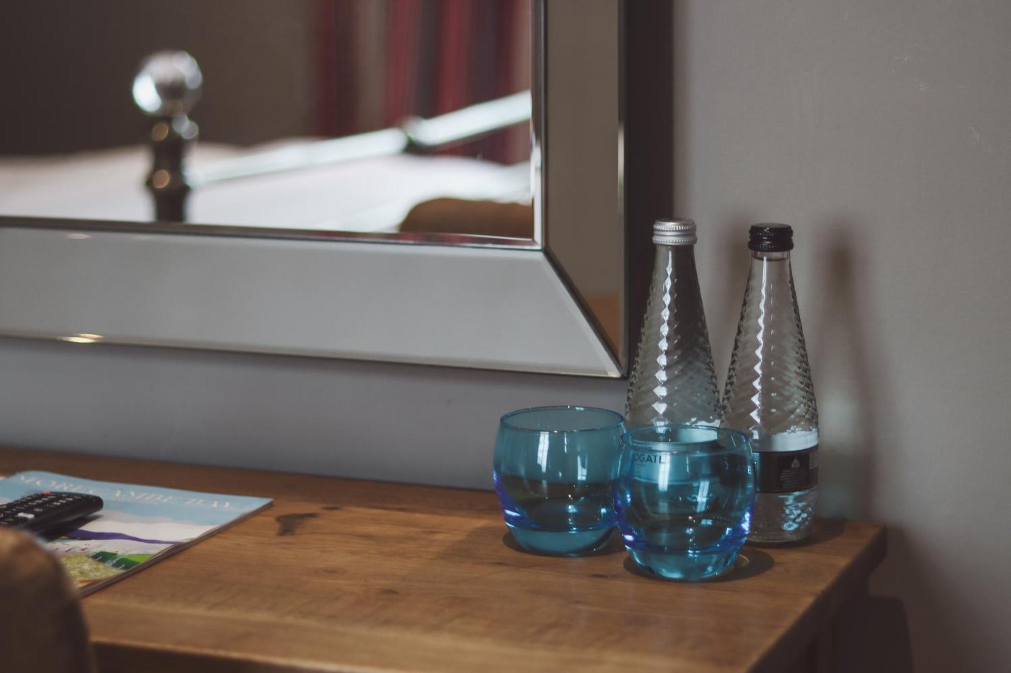 Longlands Inn & Cottages Carnforth Bagian luar foto Bottled water in a hotel room
